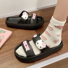 Step into summer with style and cuteness in our Sanrio Hello Kitty Slippers. These women's flat shoe sandals feature a double strap design that adds a trendy touch to any outfit. Perfect for sunny days and warm nights, they're the ultimate combination of comfort and adorable Hello Kitty charm. Cute Spring Slip-on Slides, Cute Slip-on Slides For Spring, Cute Slip-on Slippers For Summer, Cute Flat Heel Sandals For Summer, Playful Open Toe Slides For Summer, Playful Open Toe Slides For Spring, Cute Flat Heel Synthetic Sandals, Cute Spring Slides, Cute Flat Non-slip Sandals