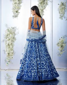 This blue lehenga set features intricate resham embroidery on softest tulle. The outfit is paired with a v-neck blouse and with a four-sided embroidered net dupatta.From Seema Gujral's Tuscan Summer collection. DELIVERY TIMEPlease allow 8-12 weeks for your outfit to arrive. FABRIC DETAILSNet Professional cleaning only. Seema Gujral, Resham Embroidery, Resham Work, Work Lehenga, Blue Lehenga, Embroidered Lehenga, Indian Dresses Traditional, Blue Embroidery, Net Dupatta