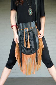 Boho style fringed leather bag black with tan fringes and black bone choker Bone bead choker attached as decoration Fully lined inside with one pocket. strap can be adjusted to several lengths. Material: leather, cow bones 26 cm wide,39 cm long. total long include leather fringes 60 cm Best finishing quality Please note that our products are handmade with some natural materials. For this reason the used materials such as leather and feathers may have slight variations in color. Please do not for Elegant Leather Fringe Bags, Beige Leather Bags With Fringe, Leather Fringe Tote Shoulder Bag, Boho Leather Purse, Western Leather Bag With Fringe, Black Leather Fringe Bag, Leather Fringe Bag, Cow Bones, Boho Leather