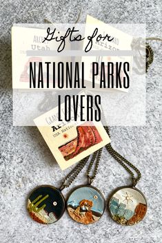 three necklaces with the words national parks lover's written on them