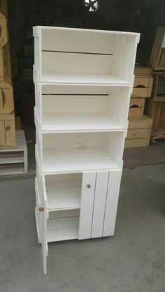 a white bookcase with doors and drawers