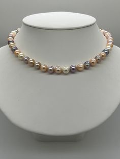 Multi Color Freshwater Pearl Necklace. This necklace features 47 Multi Color Freshwater Pearls AAA High Luster Round to Near Round 8.3-9.1mm white, apricot, peach, lavender, mauve Genuine Pearls and natural colors, no treatments. These beautiful pearls are all nacre. I hand knotted these with white silk and finished them with a 925 silver magnetic fold over clasp. The necklace measures 18 inches in length. The necklace pictured is the one you will receive. Please visit our shop for more pearls a Peach Lavender, Glamorous Jewelry, Corpus Christi Tx, Freshwater Pearl Necklace, Freshwater Pearl Necklaces, White Silk, Natural Colors, Fold Over, Pearl Jewelry