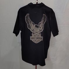 a black shirt with an eagle on it