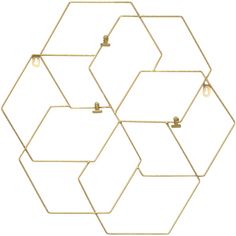 three gold hexagons are hanging on the wall