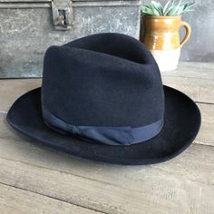 "Black Felt Homburg Fedora Hat 1910s, Paris by Tirard Freres Beautiful and genuine period mens hat. Gentleman's black felted Homburg fedora hat, black grosgrain silk ribbon band. Inner leather band has the gilded company logo and the silk inner lining has blue printed detailing with a heraldic crest for \"Tirard Freres\", \"Paris\". The \"Chapellerie Tirard\" worked between 1878 and 1956. Measures; approx. 21.75\" interior circumference, 7.75\" front to back and 6.25\" side to side. Hat is Not s Vintage Top Hat With Flat Brim, Formal Fitted Six-panel Hat, Vintage Fitted Fedora With Flat Brim, Vintage Fitted Brimmed Fedora, Vintage Fitted Fedora With Brim, Vintage Fitted Wool Fedora, Vintage Formal Hat Bands, Vintage Formal Hat Bands In Solid Color, Vintage Wool Top Hat With Short Brim