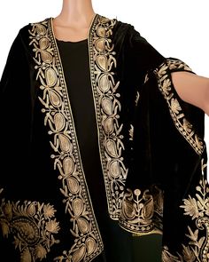 "A new style of wearing a shawl in two ways. Designed exclusively with a trend setter in mind.  Velvet shawl with Metallic (Kashmiri Zari Tilla) Embroidery Cape Scarf.  Embroidery Poncho That can be worn as a regular scarf or slide your arms though the embroidery arm slots to make it a cape poncho Wrap. The velvet cape shawl has golden metallic embroidery around the entire edges, motifs on all four corners and a large motif in the middle which will show on the back. The space for arms also has embroidery. This new style was designed for Brides, Wedding Guest even a Red carpet event. There are Few colors available to ship from Chicago IL,  we are taking orders for custom made capes which can be requested though the request order tab. Custom orders take about 4 weeks to make and ship. Fabric Elegant Winter Festive Dupatta, Elegant Winter Dupatta With Resham Embroidery, Elegant Resham Embroidery Winter Dupatta, Festive Winter Dupatta With Embroidered Border, Elegant Winter Dupatta With Zari Work, Winter Shawl Dupatta With Embroidered Border, Traditional Drape Shawl For Winter, Festive Shawl-shaped Dupatta, Bridesmaids Indian