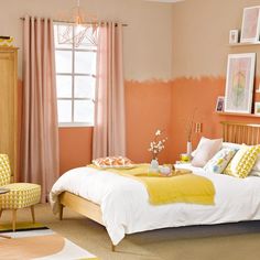 a bedroom with pink walls and yellow accents