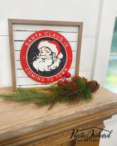 santa claus coming to town framed sign on mantle