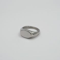 We have designed it to be smaller than a normal signet ring for a minimal and elegant look, yet still retain the classic heirloom appearance. May we suggest it might be a really cute pinky ring? Also available in Gold. Stainless Steel Band Thickness: 2mm-3mm; Oval Width: 11mm; Oval Length:7mm Silver Minimalist Signet Ring, Silver Minimalist Rounded Signet Ring, Classic Initial Ring For Everyday, Classic Initial Open Ring With Simple Design, Dainty Silver Signet Ring For Everyday, Simple Oval Sterling Silver Rings, Elegant Silver Signet Ring With Simple Design, Silver Classic Signet Ring For Everyday, Silver Oval Dainty Signet Ring