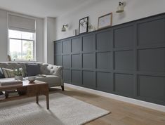 a living room filled with furniture next to a window