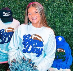 Be ready for game day with this sweatshirt! Featuring black glitter chenille, royal blue game day, and a football, it's perfect for football season and will match any school colors! So cute and comfortable, you need one of these for game days. Make football season even more fun with this sweatshirt! Unisex sizing and fit Size: Small - 3XL The sweatshirt is available in many different colors SPECIAL CARE - WASHING INSTRUCTIONS: Hand washing and air drying are always best for these items. Wash on delicate, cold, and inside out. Always air dry to prevent lint from sticking to the letters and for longevity of your beautiful items! Game Day Football, Blue Game, Womens Sweatshirts, A Football, School Colors, Football Season, Black Glitter, Washing Instructions, Hand Washing