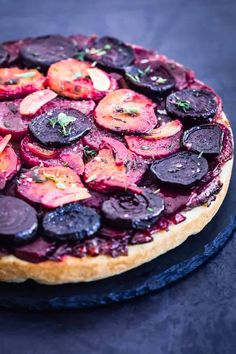 beets and carrots are on top of a pie