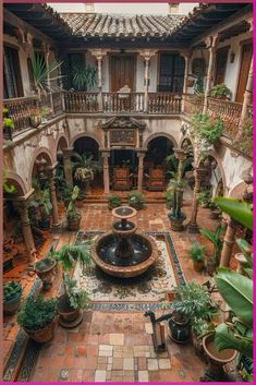 an indoor courtyard with potted plants and a fountain in the center, surrounded by arches