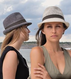 "„Marcello\" is the uncomplicated hat in trilby style for sunny summer holidays. For „Marcello\" the airy, light material „twisted paper\" was used in the colour „nature\". Available in sizes 55 cm - 58 cm. Colour: „natural\" Hat made of twisted paper. Ribbed belt made of 66% cotton and 34% polyamide. Handmade. Individualization options. Other colours or sizes on request. All hats are handmade. For the production of a perfect hat it takes some time. All hats are ready 7-12 days after payment rec Modern Beach Hats For Summer, Modern Summer Beach Hats, Modern Beach Hats For Spring, Modern Wide Brim Hat For Spring, Modern Brimmed Panama Hat For Summer, Modern Summer Hat With Short Brim, Modern Fedora Panama Hat For Spring, Modern Brimmed Summer Hats, Modern Short Brim Hat For Summer