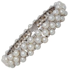 Stunning 18 kt White Gold Pearl and Diamond Bracelet Diamonds: 75, Total 1.5 Ct Pearls: 75 (size 4.5mm) Material: 18kt white gold Total weight: 47.8 gram / 1.690 oz / 30.8 dwt Measurements: Will max fit a 17 cm wrist Pearl And Diamond Bracelet, White Gold Charm Bracelet, Pink Gold Bracelet, White Gold Diamond Bracelet, Designers Jewelry Collection, Diamond Earrings Design, Expensive Jewelry Luxury, Lace Bracelet, Modern Bracelets