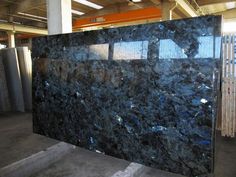 a large black marble slab in a warehouse