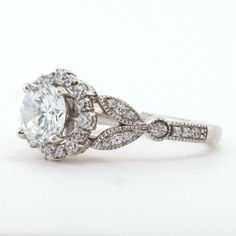 a white gold engagement ring with an oval cut diamond