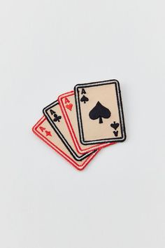 three playing cards on top of each other