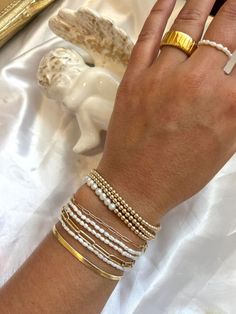 Buy this entire stack that is ready to wear! Perfect for a girl that loves a statement and high quality bracelets she can wear all the time! #highquality #summerstack #beadedballbracelets #pearls #dainty #unique #cute #Airotcivbyvictoria #highqualityjewelry #trendy #timeless #statement Stacked Bracelets Jewelry, Adjustable Stacked Jewelry, Elegant Adjustable Stacked Bracelets, Elegant Stacked Bracelets For Gift, Everyday Stacked Bracelets, Elegant Adjustable Stacked Beaded Bracelets, Elegant Stacked Bracelets, Stacked Bracelets As Gift, Trendy Hand Wrapped Jewelry