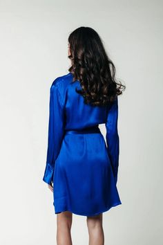 The oh-so classy Dorin Satin Wrap Dress in vibrant blue has been flying off of our shelves. It's gorgeous shiny fabric with side wrap detail feels amazing and looks stunning on everyone that wears it. Grab this wrap-dress while you still can. Perfect for the holiday season or to knowck their socks off at work, a date night, or dinner with friends. Wrap dress 100% Polyester Hand wash cold, do not tumble dry, lay flat to dry, iron at low temperature or dry clean Regular fit Wrap closure Delicate i Silk V-neck Wrap Dress For Night Out, Blue Wrap Dress With Surplice Neckline For Formal Occasions, Blue Formal Wrap Dress With Surplice Neckline, Blue Wrap Evening Dress, Blue Wrap Dress With Surplice Neckline For Party, Blue Party Wrap Dress With Surplice Neckline, Elegant Blue V-neck Wrap Dress, Blue Fitted Wrap Dress For Party, Fitted Blue Wrap Dress For Party