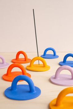 several different colored plastic objects sitting on top of a table