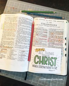 an open bible on top of a cutting board next to a pencil and ruler with the words, all things christ which straightens in me