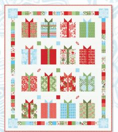 a christmas quilt with presents on it