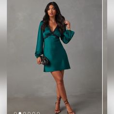 The Jazzy Satin Lace Trim Long Sleeve Mini Dress Features A Lace-Trimmed V-Neckline And Long Sleeves With Elastic Cuffs. It’s Ultra-Feminine In A Romantic Shade And Satin Fabric, Which Is Perfect For Date Night Or Special Occasions. Lace-Trimmed V-Neckline & Under Bust Emerald Color Balloon Long Sleeves With Elastic Cuffs Back Neck Ties Mini Length Smooth, Satin Fabric Side Zipper Closure 95% Polyester 5% Spandex New With Tags, Vici Green Mini V-neck Evening Dress, Elegant Green Mini Dress With Surplice Neckline, Chic Green V-neck Dress For Date Night, Green V-neck Mini Dress For Formal Occasions, Chic Green V-neck Party Dress, Elegant Green V-neck Dress For Night Out, Green Mini Length V-neck Dress For Evening, Green Mini Dress With Surplice Neckline For Date Night, Green V-neck Dressy Mini Dress