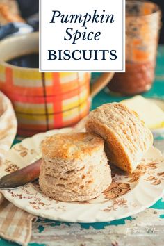 pumpkin spice biscuits on a plate with a knife and bowl in the background