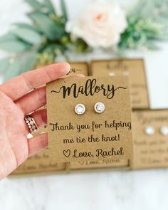 a hand holding a card that says, thank you for helping me tie the knot to love rachel