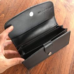 Trade your traditional wallet in and upgrade to something attractive and unique with our Stingray Leather Clutch Wallet. This clutch brings together the functionality of a conventional wallet with the elegance of a black-tie affair accessory. The exterior of this wallet is made exclusively with genuine stingray leather. The interior is made with vow leather and features a zippered coin pocket, divided bill carrier, plastic identification sleeve, and nearly a dozen card slots. The stingray leathe Formal Rectangular Wallet With Coin Pocket, Formal Rectangular Wallet With Card Slots, Elegant Compact Trifold Wallet With Coin Pocket, Elegant Compact Trifold Wallet With Card Slots, Elegant Compact Trifold Wallet With Interior Card Slots, Black Bifold Wallet On Chain With Card Slots, Elegant Formal Wallets With Rfid Blocking, Compact Formal Wallets With Card Slots, Compact Rfid Blocking Wallets For Formal Occasions