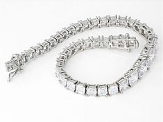 Bella Luce® white diamond simulant 25.16ctw square asscher cut rhodium over sterling silver tennis bracelet. Measures approximately 7.50"L x 0.31"W with hidden box clasp. The diamond equivalent weight is 15.24ctw. Rectangular Diamond Cut Tennis Bracelet, Rectangular Diamond Tennis Bracelet With Accents, White Gold Rectangular Tennis Bracelet For Anniversary, Fine Jewelry White Gold Rectangular Tennis Bracelet, Fine Jewelry Cubic Zirconia Tennis Bracelet Channel Set, Rectangular Cubic Zirconia Diamond Bracelet In White Gold, Rectangular White Gold Diamond Bracelet With Cubic Zirconia, Formal White Gold Tennis Bracelet With Rectangular Shape, Formal Rectangular Tennis Bracelet With Diamond Accents