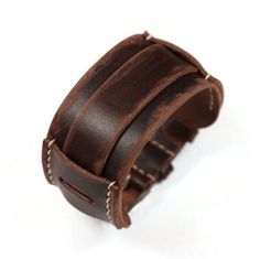 Cuff leather bracelet for men made from the best Italian leather. Distressed leather bracelet fits well on the wrist and looks stylish. Handmade wide leather cuff with vintage effect durable and comfortable. If desired, the bracelet can be worn with a watch. I wanted the wrist cuff bracelet to look like it was many years old and deliberately scratched the skin. No two bracelets are the same. If you accidentally make a scratch on the bracelet, it will give it more vintage and beauty. The cuff bracelet is made of luxury Italian leather from the Badalassi Carlo. Vegetable tanned leather, environmentally friendly, breathable. It smells nice of genuine leather. The leather cuff has a beautiful rich brown color with a vintage effect. Over time, it will become covered with a patina and become eve Handmade Leather Bracelets, Brown Leather Bracelet, Leather Cuff Bracelet, Wrist Band, Leather Cuffs Bracelet, Star Bracelet, Wrist Cuffs, Leather Cuffs, Distressed Leather