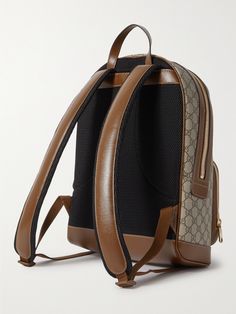 Gucci's backpack has a classic, vintage appeal – as such, it's the kind of style that'll look good with some signs of wear. It's made from the house's signature 'GG Supreme' coated-canvas and outlined with brown leather trims. Designer Coated Canvas Backpack For Business, Designer Business Backpack In Coated Canvas, Gucci Standard Everyday Backpack, Brown Gucci Standard Backpack, Gucci Brown Standard Backpack, Gucci Brown Backpack For Daily Use, Luxury Coated Canvas Backpack For Everyday, Designer Leather Travel Backpack, Designer Backpack With Leather Trim For Daily Use