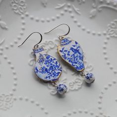 I am Chinese illustrator.There are so many ancient Chinese porcelain in Chinese museums!Now I made them into jewelry!This is Ancient Chinese porcelain design inspired,not really Ceramic.I used Polymer Clay to make these.They are so beautiful and light and should not be strong bent! I hand painted this ! You can see the painting texture in my work and feeling my creative process!And Each one will be slightly unique. I can not painted the same next time!This design is my original illustration.Usually my work includes mixed media,such as beads,paint,collage. This purchase does not include duplication rights of any kind.The copyright remains total mine. Please do not wear in the pool,shower in order to extend the life of the Jewelry. Earrings are 925 sterling silver! All of my items are made t Vase Earrings, Chinese Porcelain, Ancient Chinese, Butterfly Earrings, Polymer Clay Jewelry, Vintage Earrings, Flower Vases, Clay Jewelry, Silver Fashion