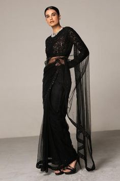 Black with all-over delicate embellishments. Comes with crotchet blouse.
Component: 2
Embellished, Embroidered
Neckline: Round
Sleeve Length: Full
Fabric: Net
Color: Black
Zip closure at the back
Note: The neckpiece worn by the model is not for sale. - Aza Fashions Black Net Saree, Blazer And T Shirt, Black Saree, Net Saree, Blouse For Women, Embroidered Neckline, Mens Designer Fashion, Saree With Blouse, Crop Top Blouse