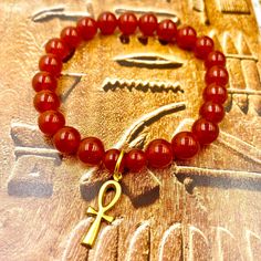 Adorn Yourself with these simple yet powerful gemstone bracelets w/ Brass Ankh Charm. Perfect as a gift, for stacking and everyday wear. 8MM Gemstone 1/2 Inch Brass Ankh Charm and non-tarnish 18k Gold Connector Ring. Fits Size 7 1/2 Wrist Carnelian Bangle Bracelet Gift, Spiritual Carnelian Bracelet Gift, Spiritual Onyx Beaded Bracelets Gift, Spiritual Stackable Charm Bracelet Gift, Symbolic Gemstone Bracelet As Gift, Adjustable Onyx Stretch Bracelet Gift, Adjustable Amber Stretch Bracelet As Gift, Hand-strung Onyx Bracelets As A Gift, Adjustable Amber Stretch Bracelet For Gift