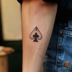 Minimalistic Ace of Spades tattoo on the forearm, a perfect choice for those who love subtle yet impactful designs. Simple and stylish. Check out inktat2.com for more inspiration. Save this pin! Spade Tattoo For Women, Spade Tattoo Design, Ace Of Clubs Tattoo, Clubs Tattoo, Spades Tattoo, Ace Of Spades Tattoo, Spade Symbol, Playing Card Tattoos, Spade Tattoo