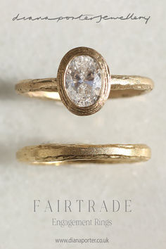 two gold rings with a white diamond in the middle and an engagement ring on top