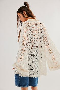 So cool and classic, this goes-with-anything kimono is the perfect piece to pair over anything from a basic bikini to a timeless tank. **Features:** Crochet fabrication, embroidered detailing at front, bell sleeves, tie-front closure, sheer design, lace-adorned trim **Why We ❤ It:** The true definition of an effortless essential, this wear-anywhere kimono is sure to be the top addition to your warm weather collection. | Bell Sleeve Lace Kimono by Free People in White Bohemian Tops For Poolside, Fitted Summer Kimono With Embroidery, Fitted Embroidered Summer Kimono, Fitted Summer Embroidered Kimono, Cotton Open Front Tops For Beach, Open Front Cotton Tops For Beach, Unlined Tops For Beach In Spring, Unlined Top For Spring Beach Outings, Unlined Tops For Beach And Spring Season