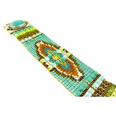 Chili Rose Beaded Turquoise & Gemstone Bracelet by Adonnah Langer of Santa Fe, New Mexico Gorgeous Diana Bracelet features a Southwestern blend of turquoise, olive green and red Swarovski beads handcrafted with a true artistic mix of beads and a canvas of gorgeous colors. Gorgeous Turquoise Oval Medallions Grace the ends of this woven beaded bracelet *Measures 6 3/4 inches to 7 1/2 inches- please specify (made to order) *Medallion measures 1 1/4 inch x 7/8 inch *Sterling Silver .925 *Hidden Lock Artisan Turquoise Beaded Bracelets Adjustable, Handmade Southwestern Green Beaded Bracelets, Artisan Green Handmade Bracelets, Handmade Green Southwestern Beaded Bracelets, Adjustable Turquoise Beaded Artisan Bracelets, Southwestern Green Bracelets For Festival, Southwestern Style Green Bracelets For Festivals, Southwestern Green Beaded Bracelets With Round Beads, Southwestern Green Beaded Bracelets For Festival