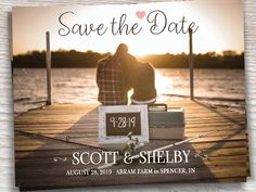 save the date card with two people sitting on a dock