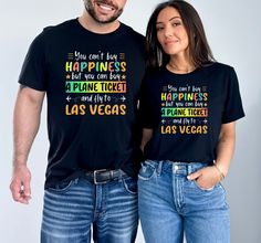 a man and woman wearing t - shirts that say happiness but you can't travel