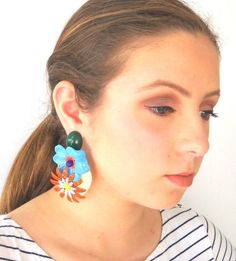 Huge enamel colorful flower oversize statement earrings, This unique jewelry piece is quite dramatic and eye-catching! Definitely not for everyone.You can Buy ONE earring or a pair - please choose from variations.The earring is made of vintage enamel metal and plastic parts and dangles from a secured well balanced dark green stud.Wear it and march on the red carpet!Item dimensions:Length:  9 cm // 3.54 "Width: 6.5 cm //  2.56 "Colors: light blue, orange, creamMore huge flower earrings:https://ww Unique Flower Earrings For Parties, Colorful Flower Earrings For Spring, Multicolor Drop Flower Earrings For Spring, Multicolor Drop Earrings For Spring, Multicolor Enamel Earrings For Party, Trendy Multicolor Flower Earrings For Spring, Multicolor Spring Flower Drop Earrings, Playful Multicolor Earrings For Spring, Trendy Multicolor Flower Earrings