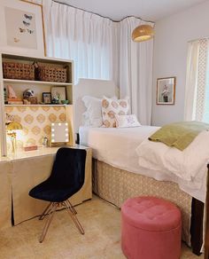 a bedroom with a bed, desk and chair in it's centerpieces