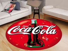 a coca - cola rug in the middle of a living room