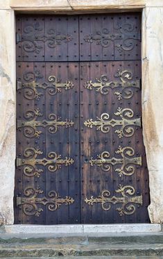 an old wooden door with intricate designs on it