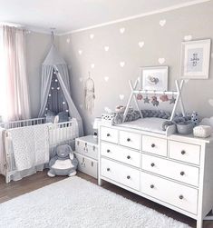 a baby's room with hearts on the wall