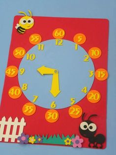 a red clock with yellow numbers and a bee on it