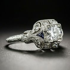 an old - fashioned diamond and sapphire engagement ring